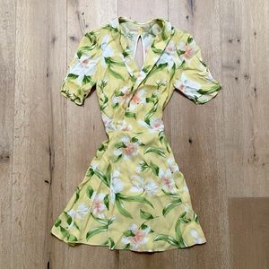 Reformation yellow floral wrap Calais mini dress.